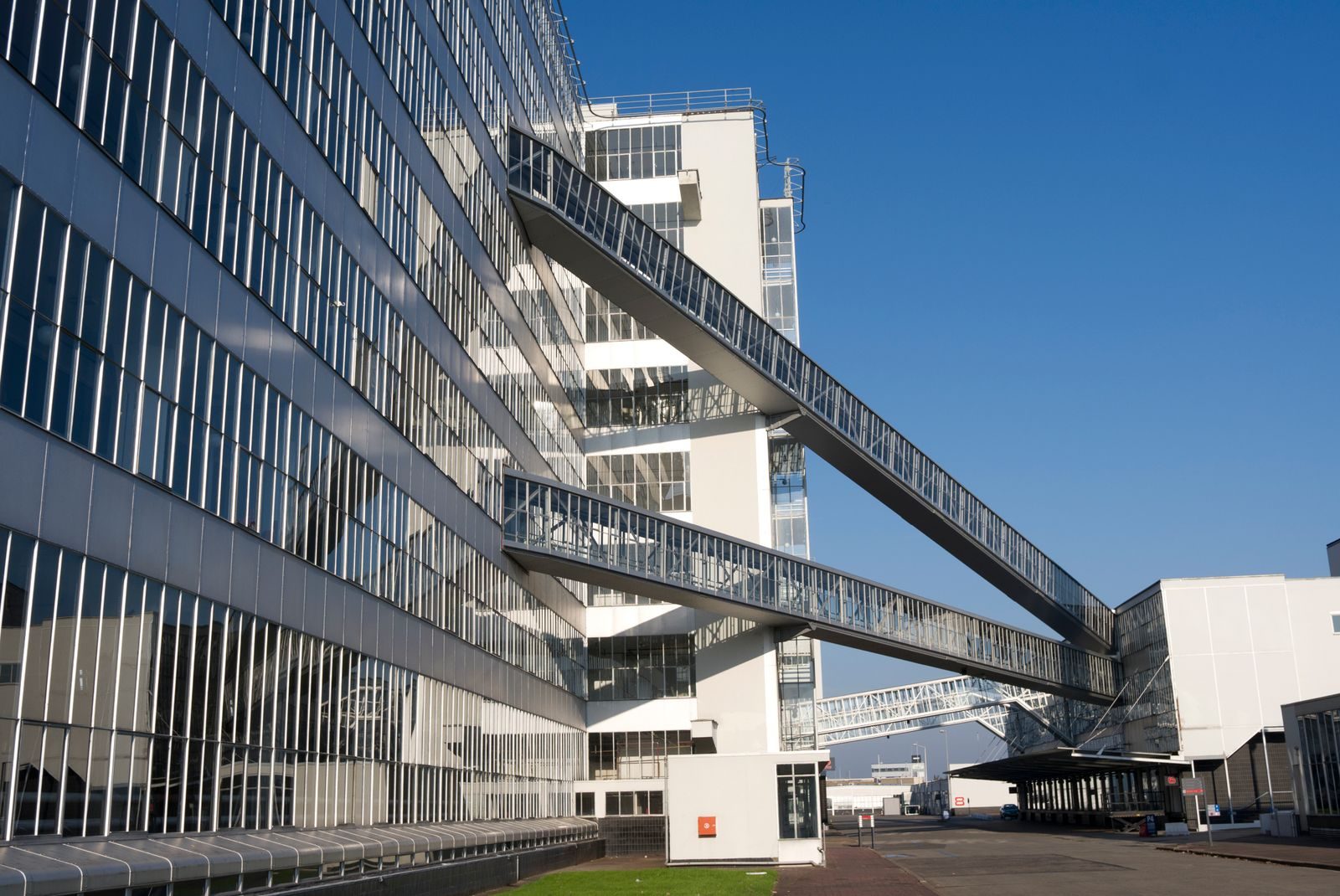 Illustrative — modern factory facade at dusk